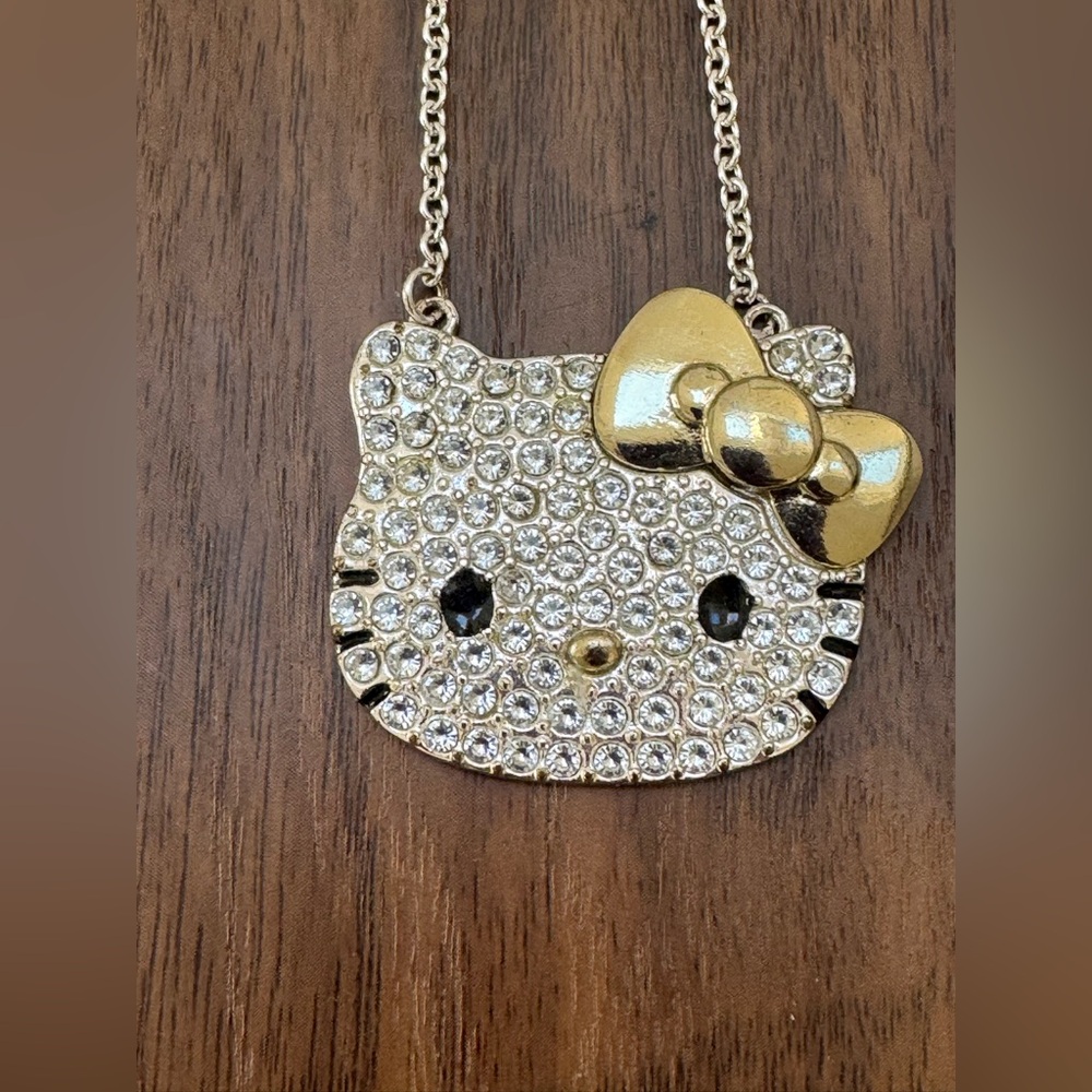 Hello Kitty Sanrio Pave Silver Crystal Necklace With A Gold Tone Bow And Nose